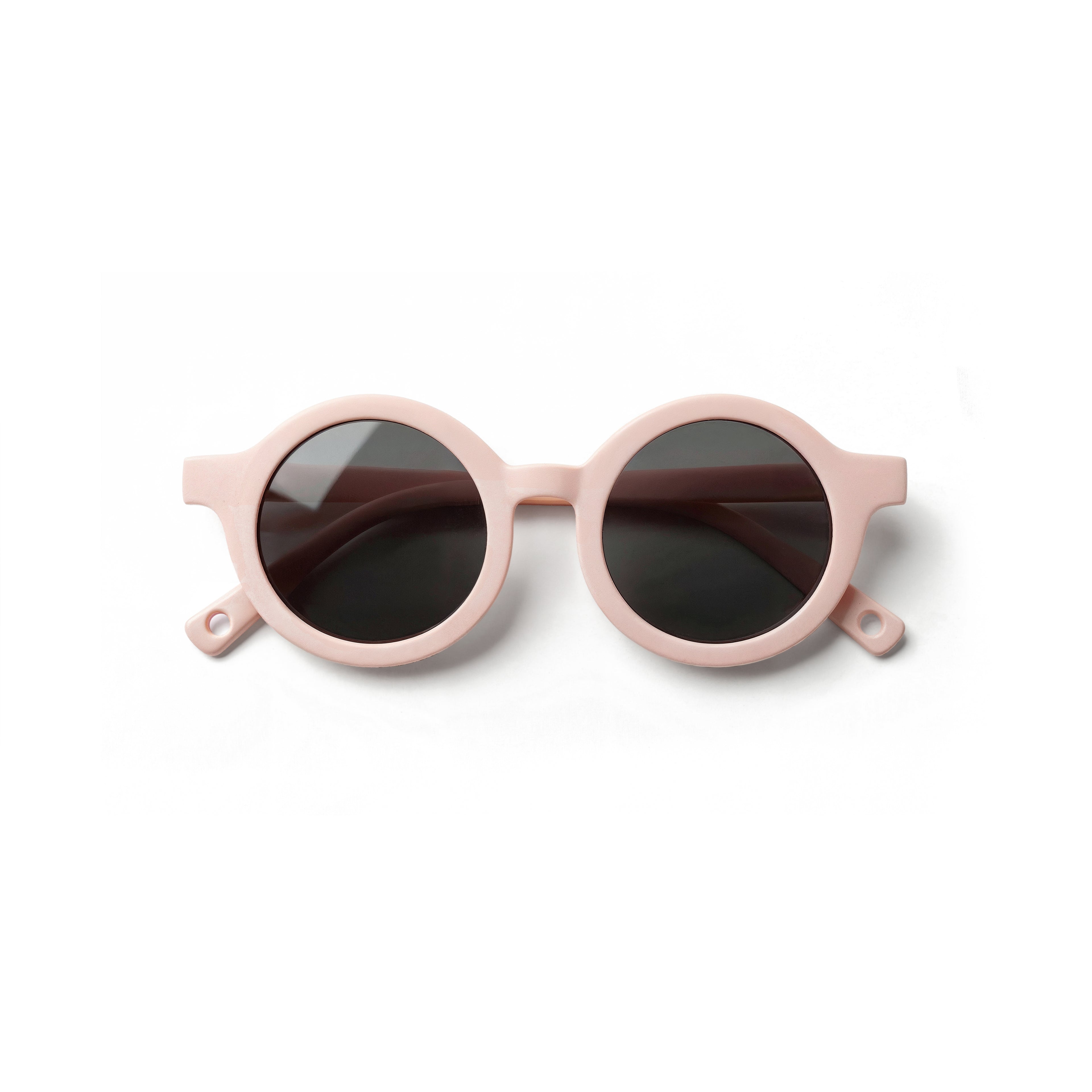 Occhiali da sole zo-oz stile tondo modello Bam rosa opaco per bambini 0-2 anni piegati e fotografati dall'alto.