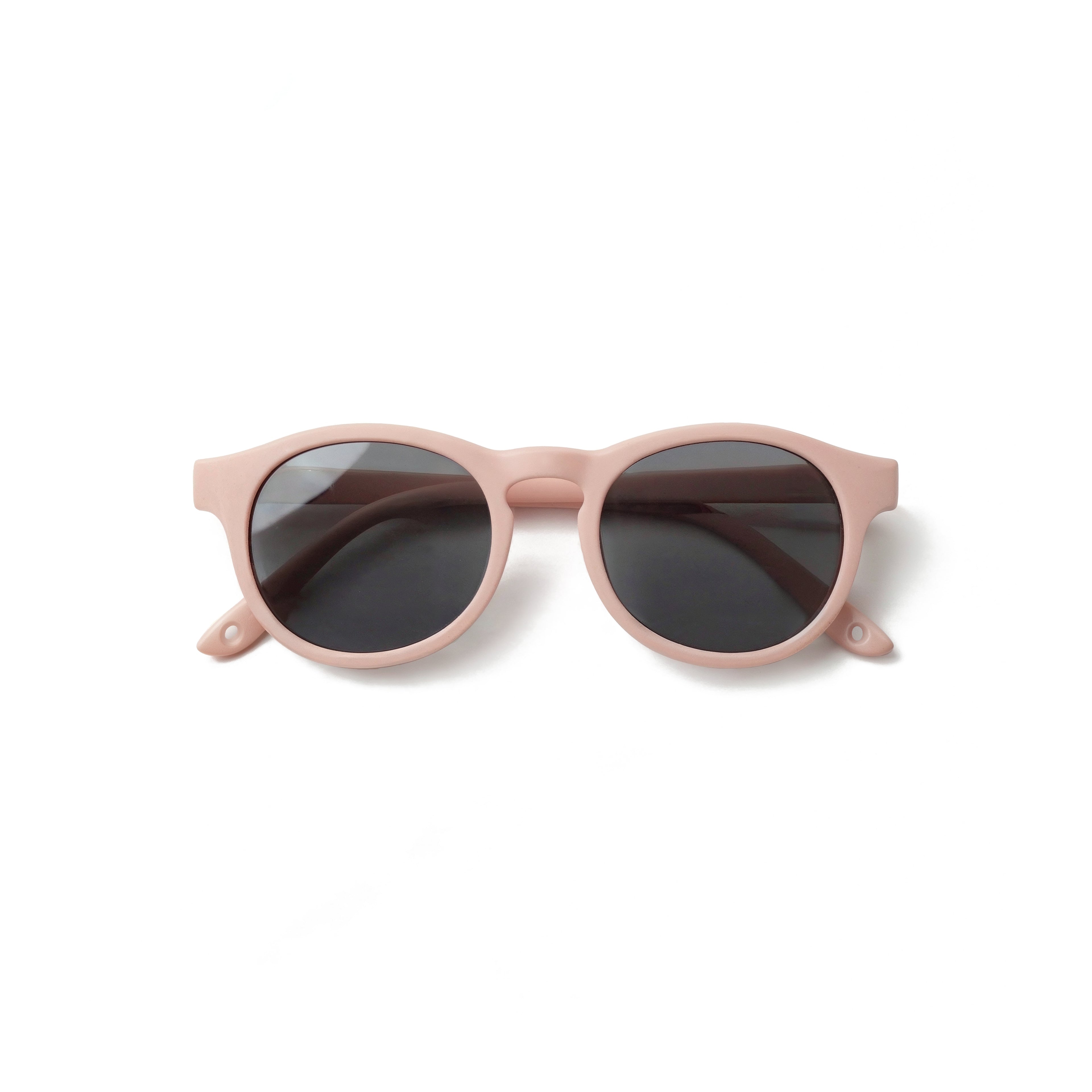Occhiali da sole zo-oz stile pantos modello Pop rosa opaco per bambini 0-2 anni piegati e fotografati dall'alto.